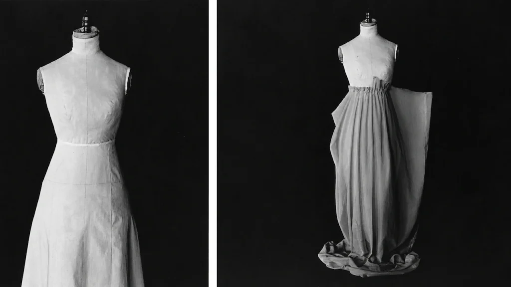 Fashion designers fitting a draped skirt on a dress form